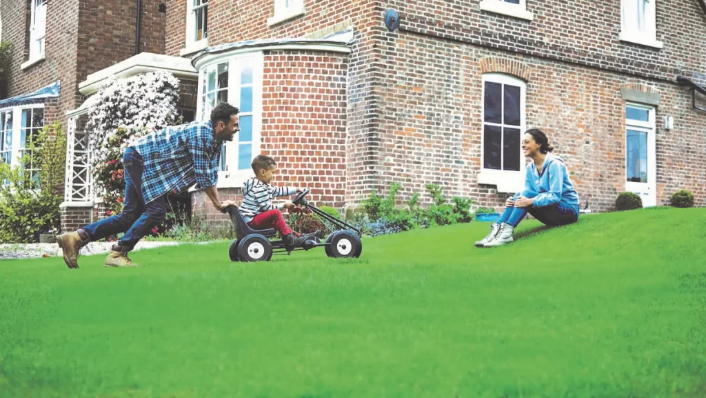 A picture of a family enjoying a beautiful lawn, Lawnscience Lawn Care East Keswick